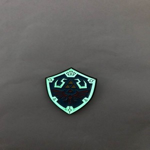 iconic Hylian Shield design soft enamel pins with glow